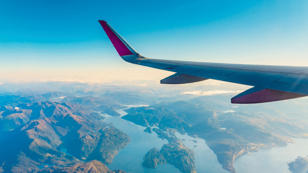 Airplane wing through the sky