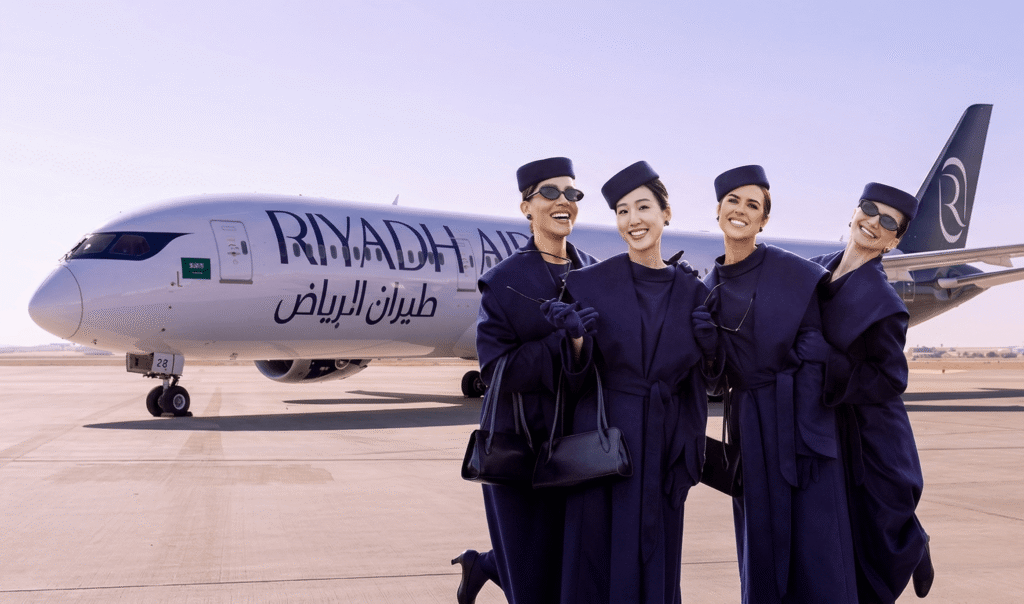 Riyadh Air Flight Attendants in front of the airplane