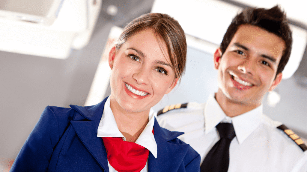Cabin crew smiling at the camera